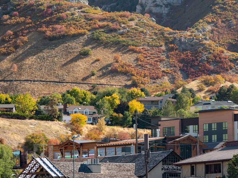 Homes and autumn foliage at the base of the Wasatch Mountains in Cottonwood Heights, Utah, near the mouth of Big Cottonwood Canyon