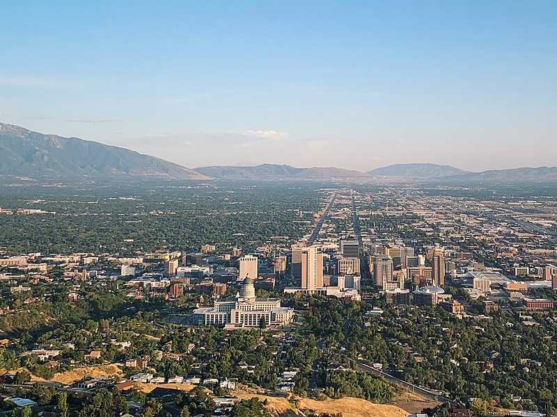 Salt Lake City skyline and Utah State Capitol from Ensign Peak, with Wasatch Mountains beyond